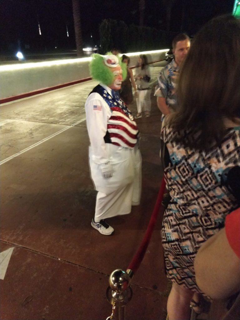 Silent and kinda creepy clown greeting people